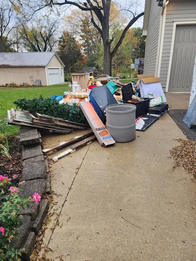 Dumpster being loaded with debris for Residential Dumpster Rental in Lochbuie